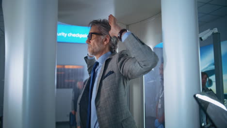 man going through airport security checkpoint