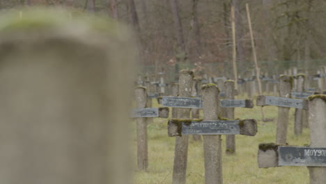 pan over old and abandoned graveyard with rotten crucifixes