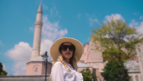 Slow-Motion:Beautiful-young-girl-poses-in-front-of-an-ancient-building-in-Istanbul,Turkey,Travel-concept