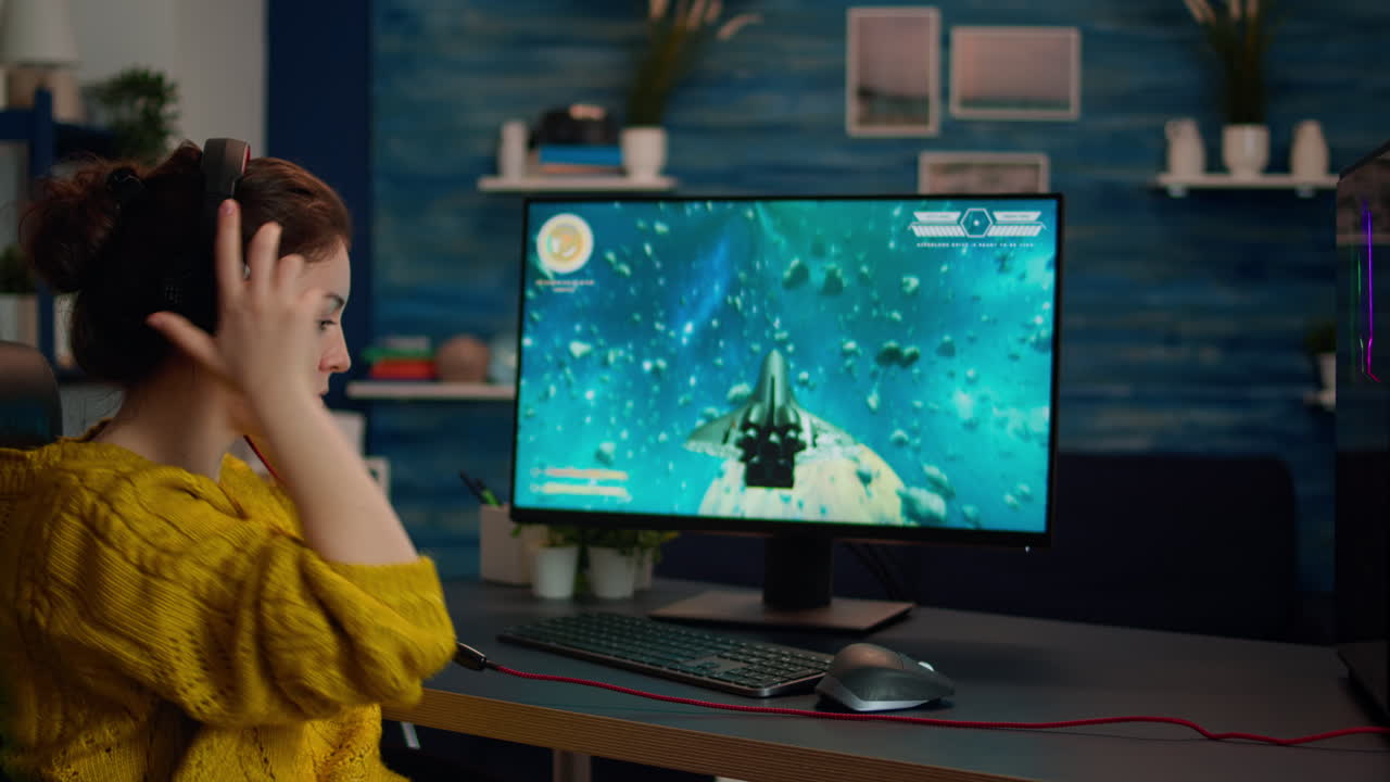 Woman gamer putting headphone and playing online shooter game