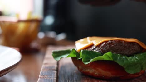 chef preparing a delicious cheeseburger