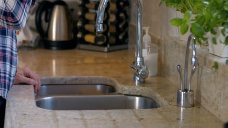 woman pouring her glass with water