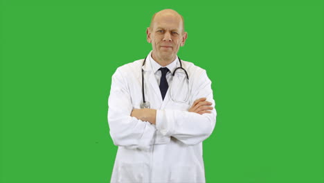 a happy doctor wearing a scientist white lab coat smiles and folds arms. the man is wearing a shirt and tie with stethoscope.