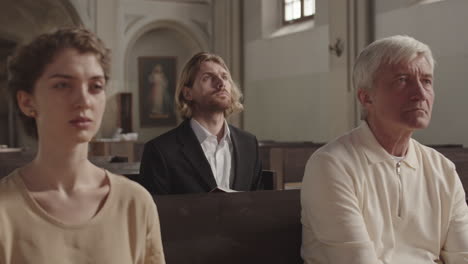 caucasian parishioners listening to preaching