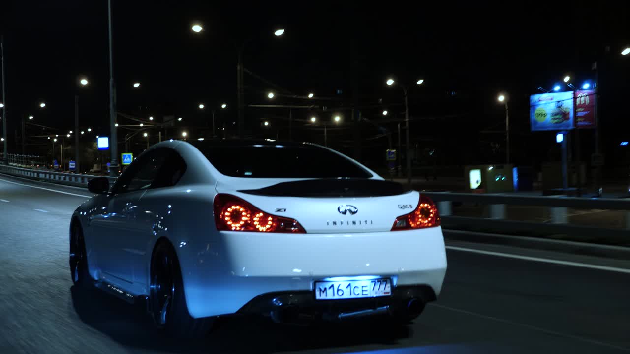 Infiniti Q60S on the road at night
