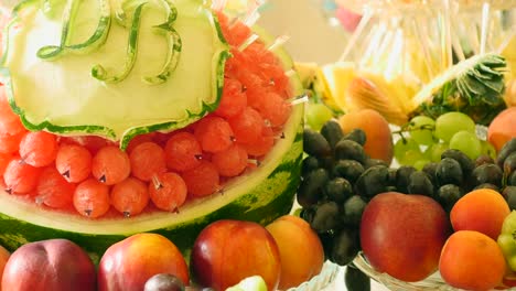 different fresh fruits on wedding buffet table. fruits and berries wedding table decoration. buffet reception fruit wines champagne. wedding table decoration