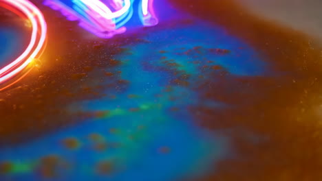 abstract neon light painting on liquid surface