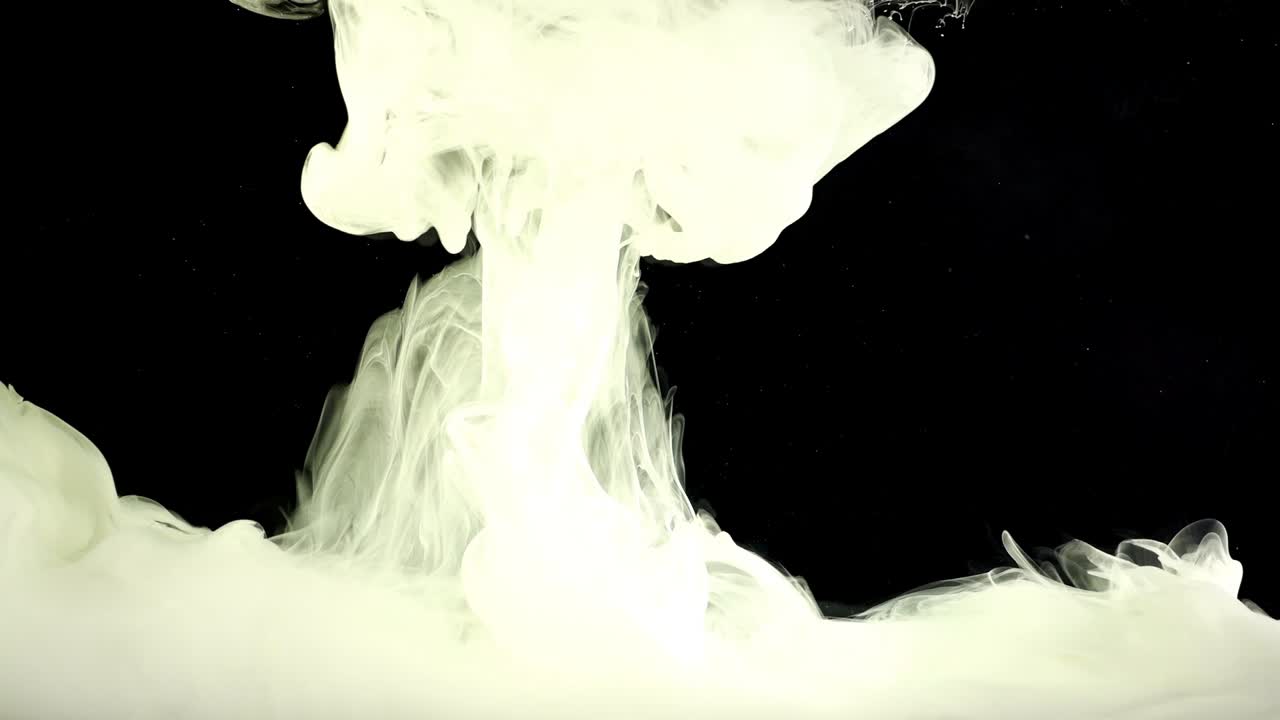 Abstract forms. Shooting on a black background. Mixing of paints