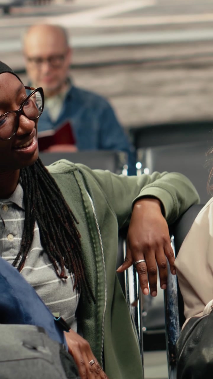 Vertical video Talking, international vacation travel and multiethnic people in airport