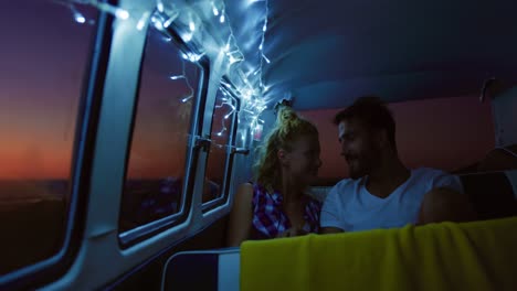 couple talking in a camper van 4k