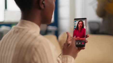 african woman explaining financial reports to remote manager on webcam