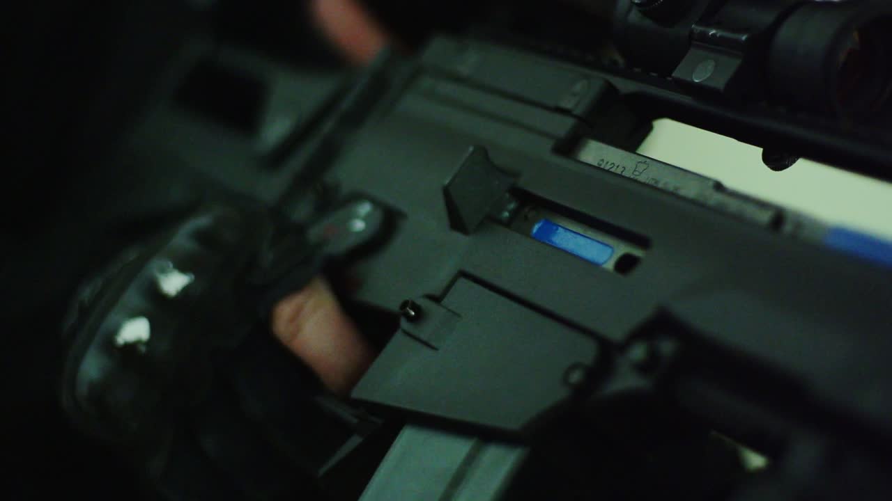 Slow motion close up, blank round fired by elite soldier in tactical simulation