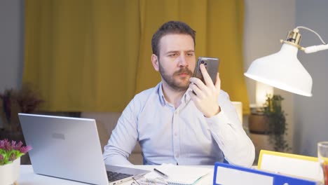home office worker man having problems and stress on the phone.