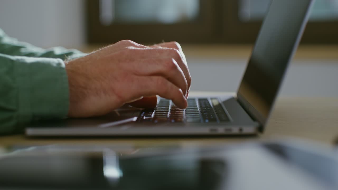 Person Typing on Laptop