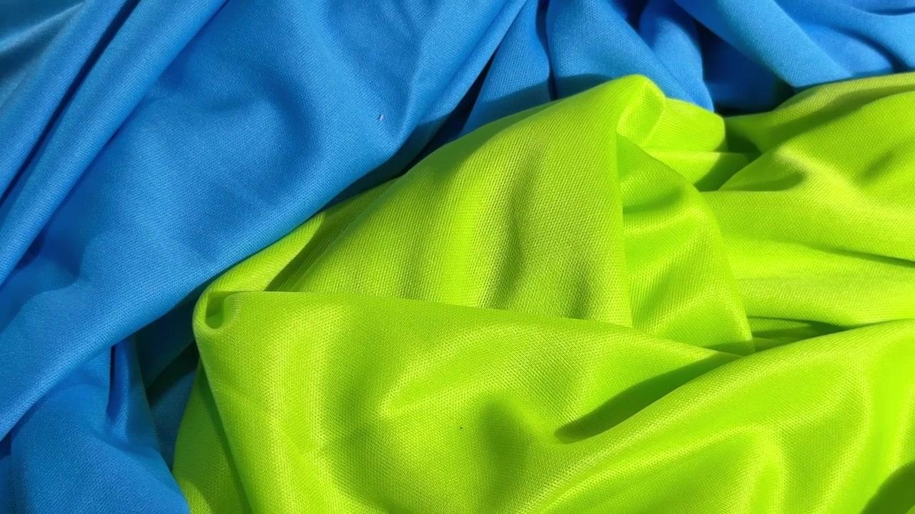 Close-up de Textura de Tecido Azul e Verde Neon