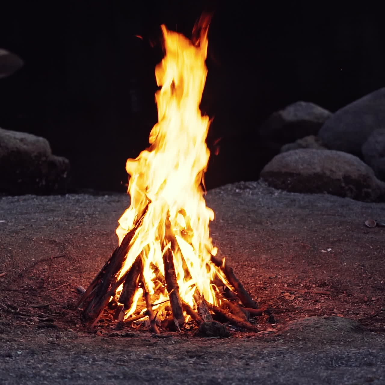 Close up of campfire burning in slow motion.