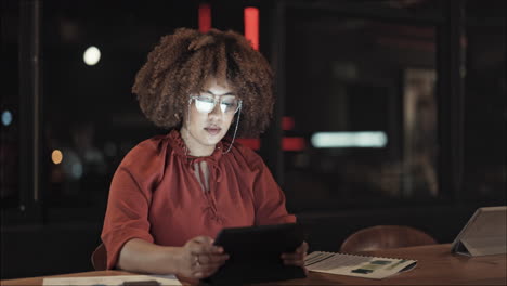 black woman, tablet and working in office at night