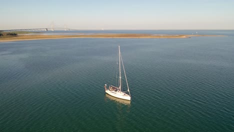 sailing boat anchoring at coast in denmark