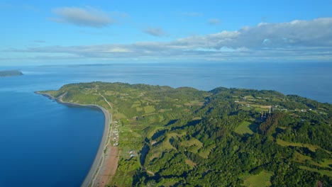 Coast-of-Lemuy-island-in-chile-showcasing-lush-landscapes-and-coastal-line,-aerial-view