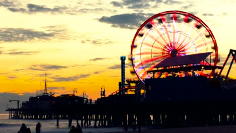sunset at santa monica pier with ferris wheel