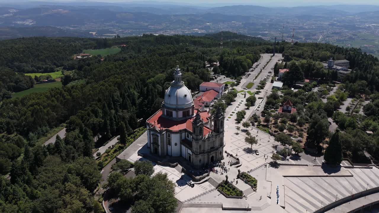 sweeping aerial rotation reveals the grand Santuario do Sameiro, nestled in Braga's hills