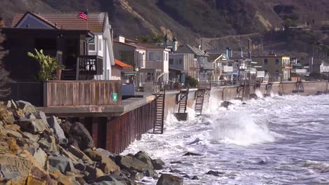 huge waves and surf crash into southern california beach houses during a very large storm event 5