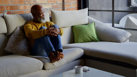 senior man relaxing in living room 4k