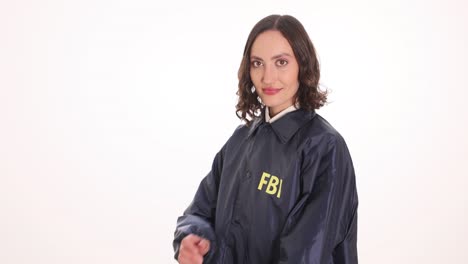 woman in fbi jacket posing in studio