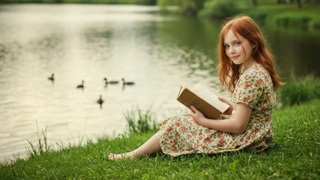 a young girl enjoys a peaceful moment by the water, reading a book while watching ducks swim by in a serene natural setting