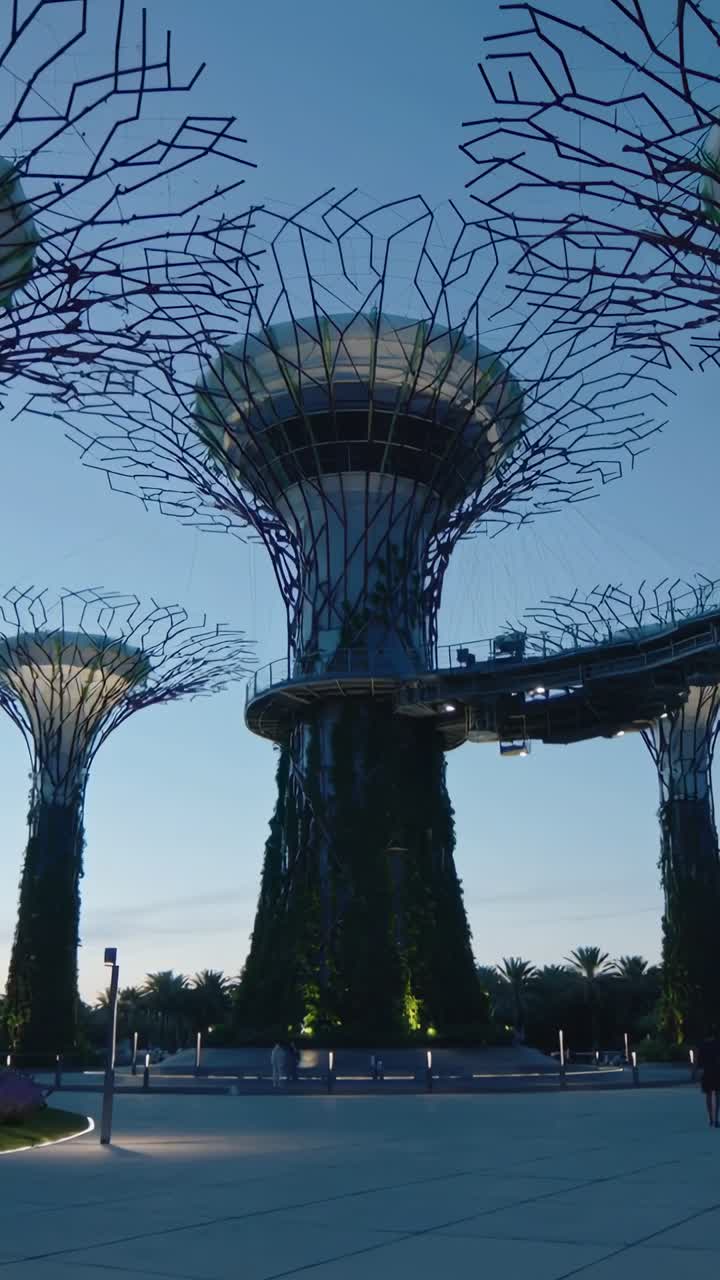 Central tower lighting as twilight deepening, animated labels on skywalk guiding guests for design