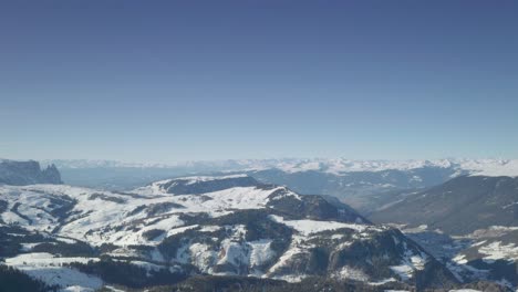 Aerial-4K-resolution-reveal-shot-of-the-Italian-Dolomites-n-Val-Gardena-ski-resort-near-Santa-Cristina