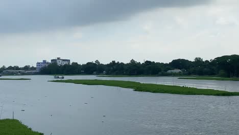 slowmotion dolly past a flooded agriculture field due to a flooded river in sylhet