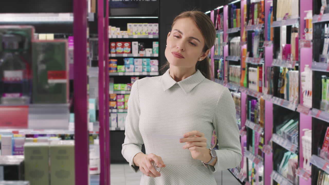 Woman Smelling Perfume With Blotter