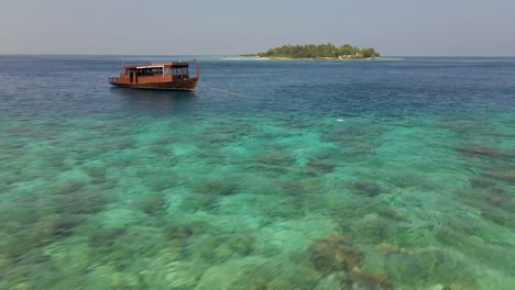 Drone-flying-past-a-traditional-Maldives-Dhonis