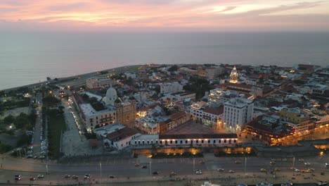Cartagena-walled-old-historical-colonial-town-at-sunset,-aerial-cityscape-Colombia-Caribbean-ocean