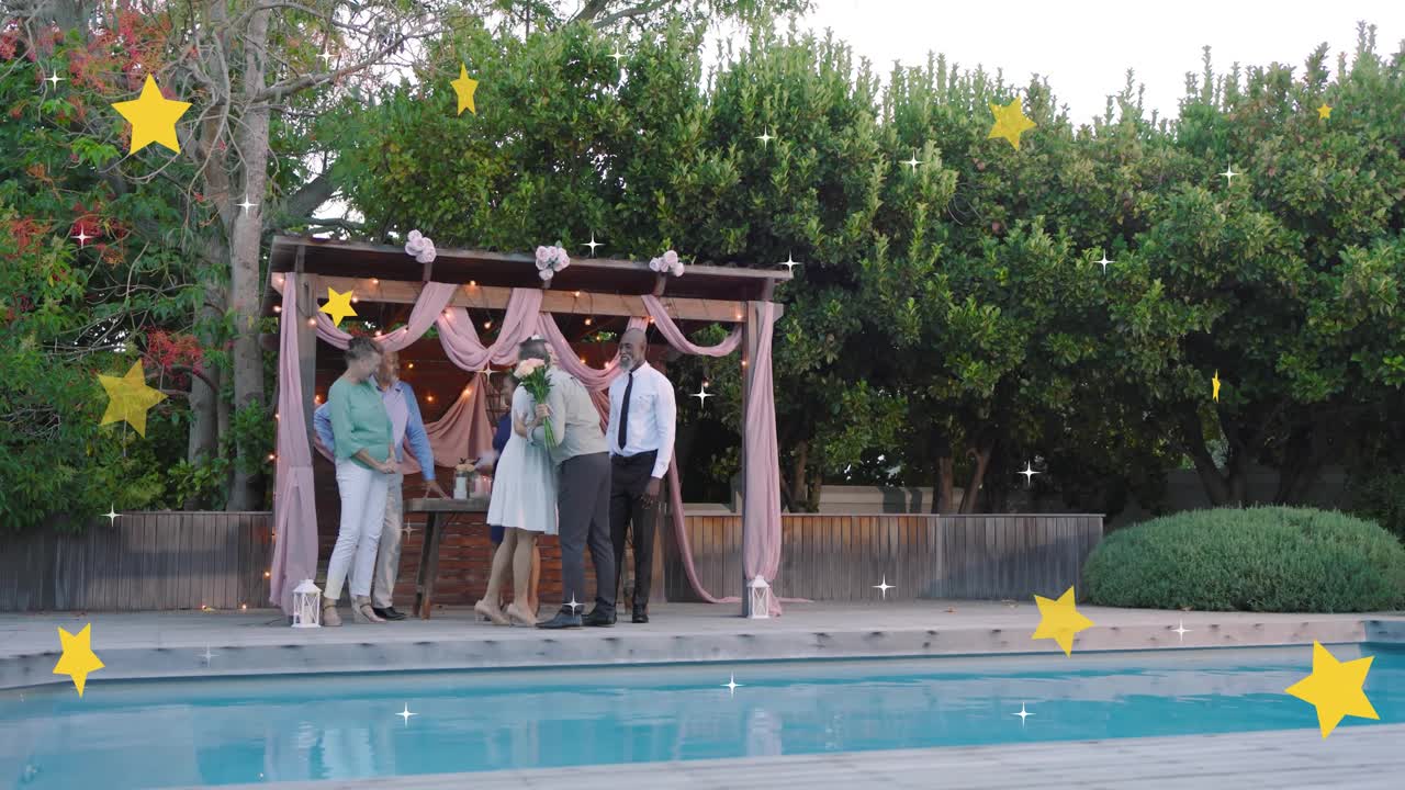 Senior woman handing bouquet, group hugging, forming line on deck for event, stars sparkling across