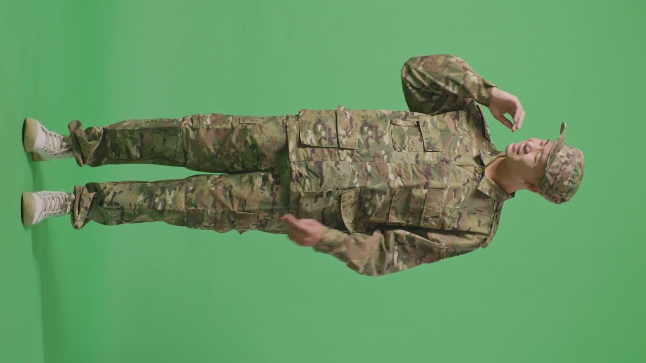Full Body Of Asian Man Soldier Wiping The Sweat And Being Tired While Standing In The Green Screen Background Studio