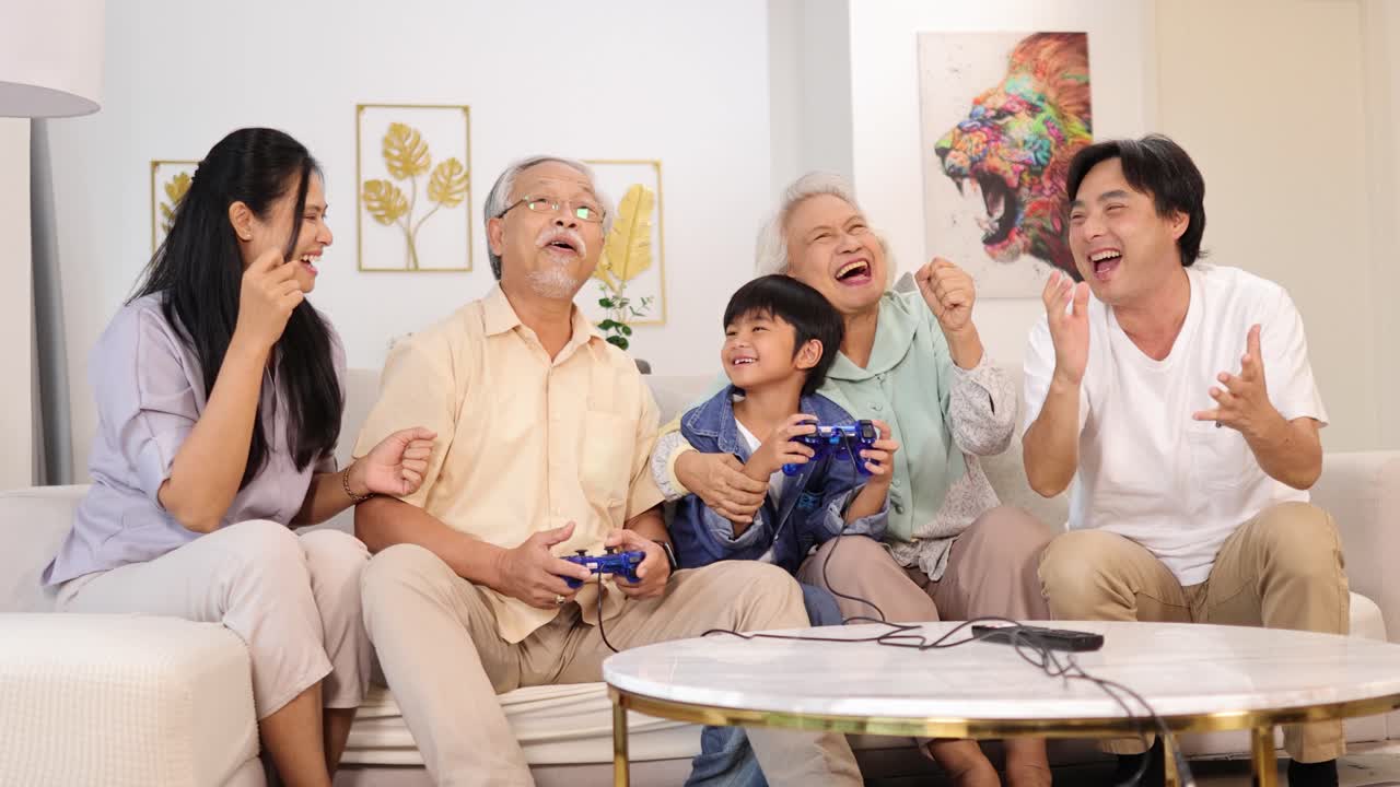 Asian family joyfully playing video games together in a cozy living room, capturing laughter and connection