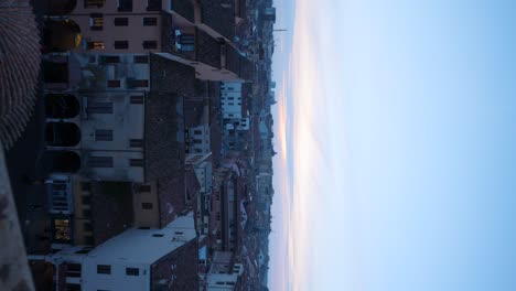 vertical shot of mantua mantova cityscape at sunset, zoom out reveal