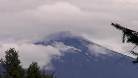 villarrica volcano, pucon, chile - april 04, 2017. clouds over villarrica volcano in pucon, chile