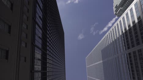 Toronto-Bay-street-skyscraper-buildings-driving-moving-tracking-low-angle-POV-dolly