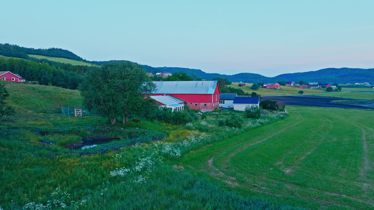 Red Barn House And Fields In Rural Norway - Drone Shot