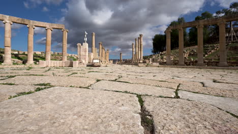 low angle shot of forum plaza stone floor with corinthian pillars in the background