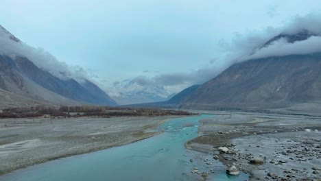 aerial view of hunza river flowing through nomal valley landscape in gilgit