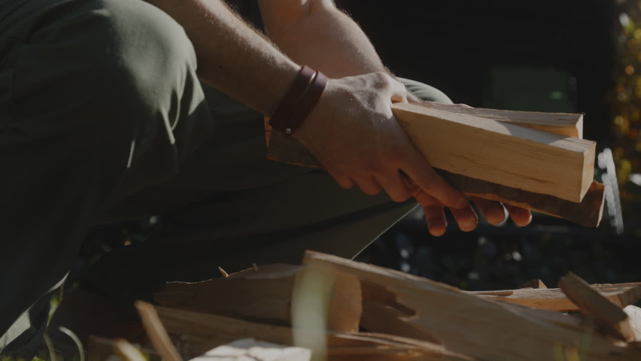 Chopping wooden log with an axe