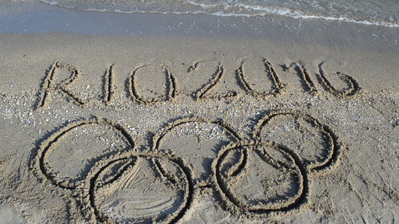 Rio 2016 an inscription on sand, the beach. Symbol Olympic game on sand, the beach