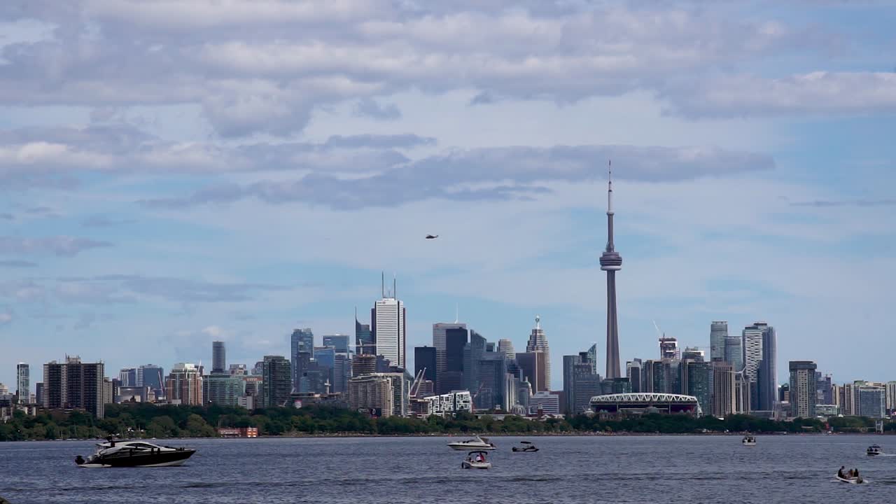 Toronto, Canada - The waterfront and a helicopter is flying in the sky of Toronto, other side showing - Wide shot