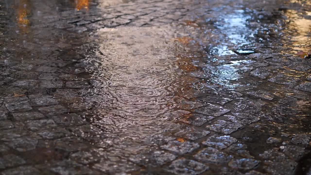 Rain Drops On Wet Cobblestone Street