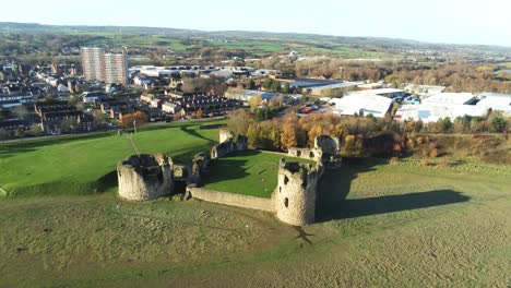 ancient flint castle medieval heritage military welsh ruins aerial view landmark pull back