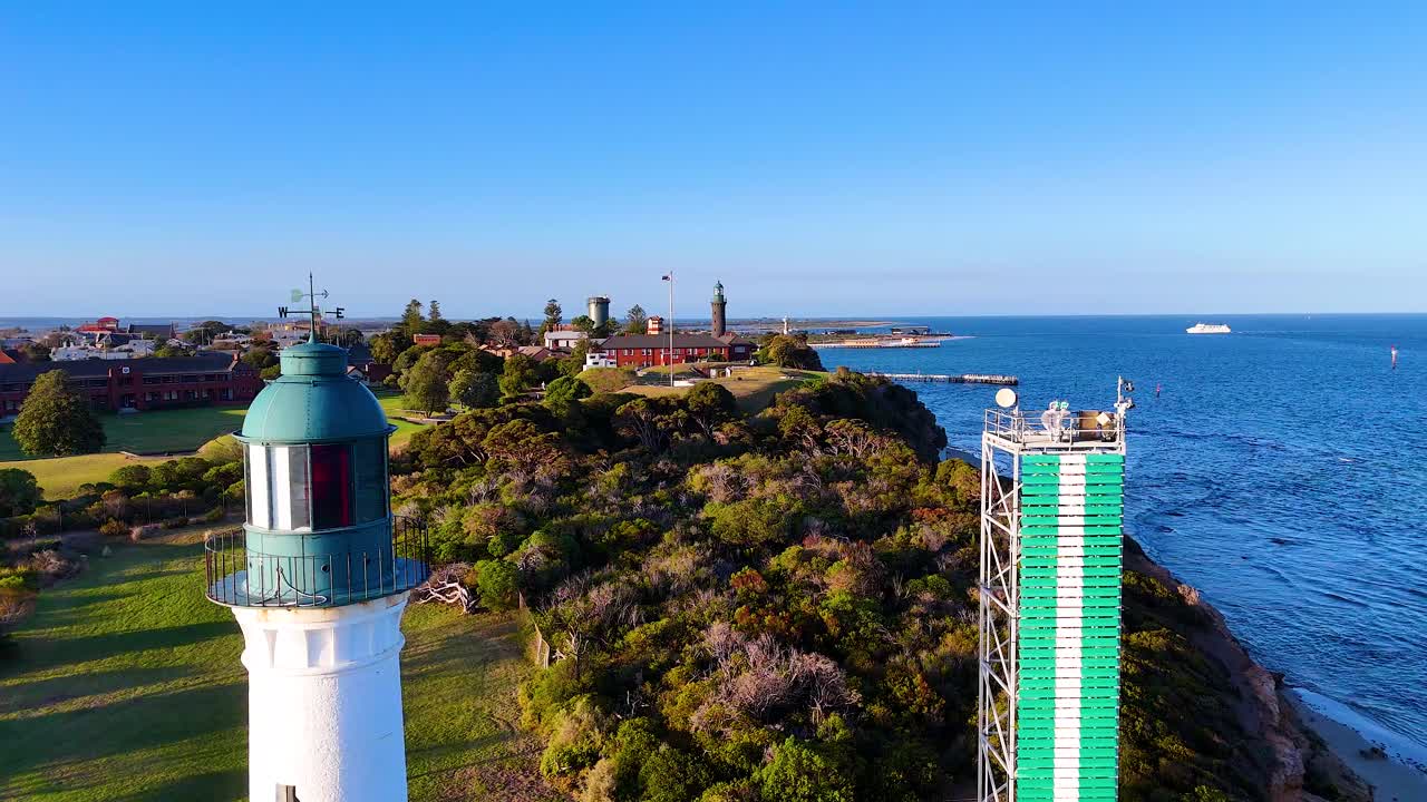 Aerial footage captures the Queenscliff Lighthouse and scenic coastline in Bellarine, Victoria, under clear blue skies